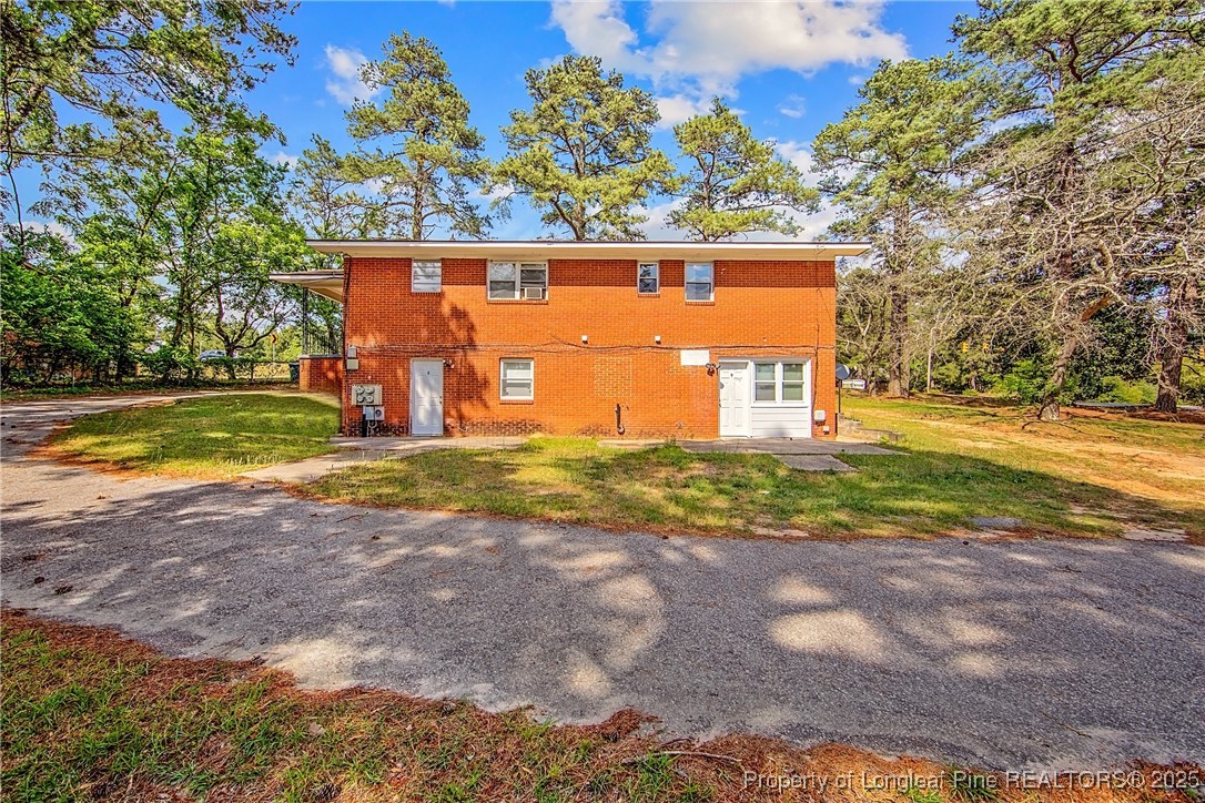 4305 Rosehill Road Fayetteville, NC 28311 - Photo 9 of 10 a view of a yard with a tree