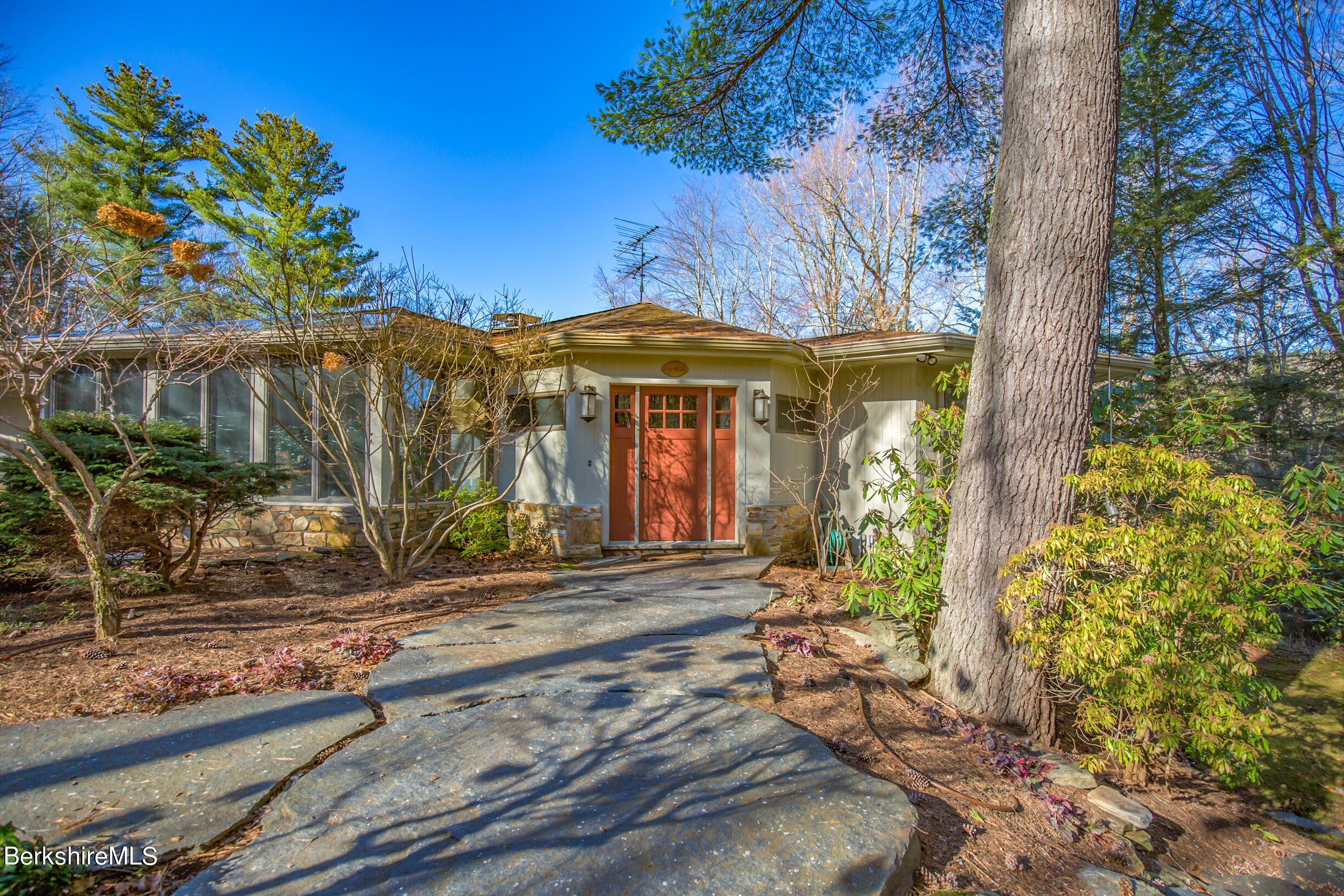 6 Bidwell Road Monterey, MA 01245 - Photo 6 of 53 a front view of a house with a yard