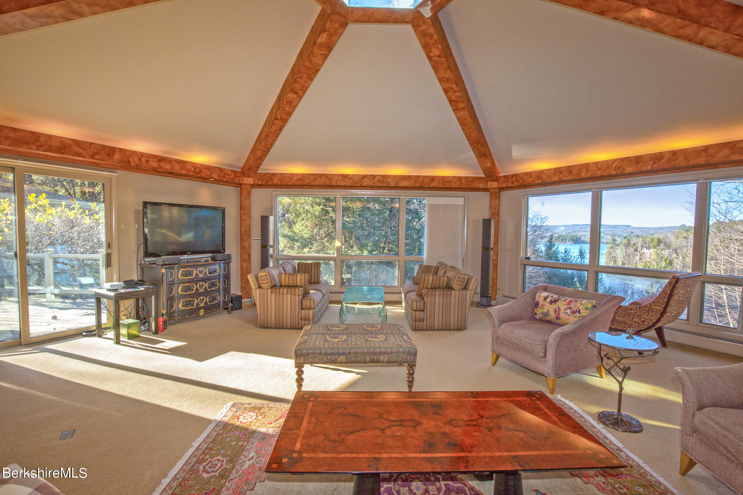 6 Bidwell Road Monterey, MA 01245 - Photo 8 of 53 a living room with patio furniture and a flat screen tv