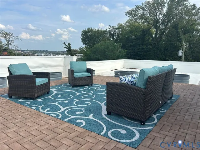 a view of a couches and a table in the patio