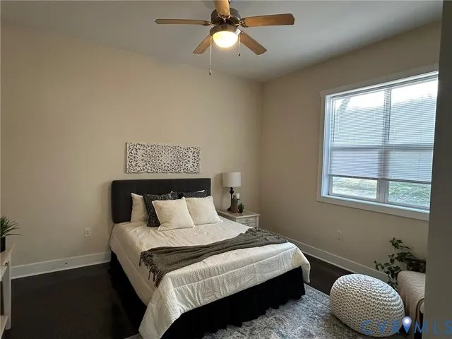 a bedroom with a bed and window