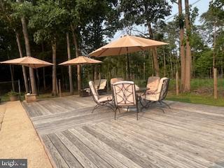 11064 Demarr Road White Plains, MD 20695 - Photo 68 of 98 Pool area tables and umbrellas