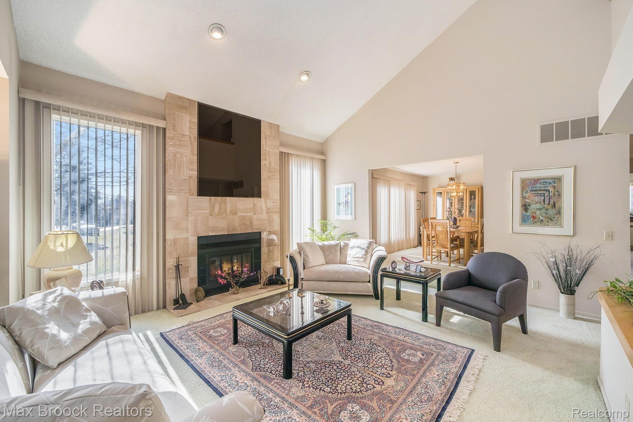 4537 Strandwyck Road West Bloomfield, MI 48322 - Photo 7 of 35 Marble gas fireplace in great room. Beautiful long windows, offering bright natural light.