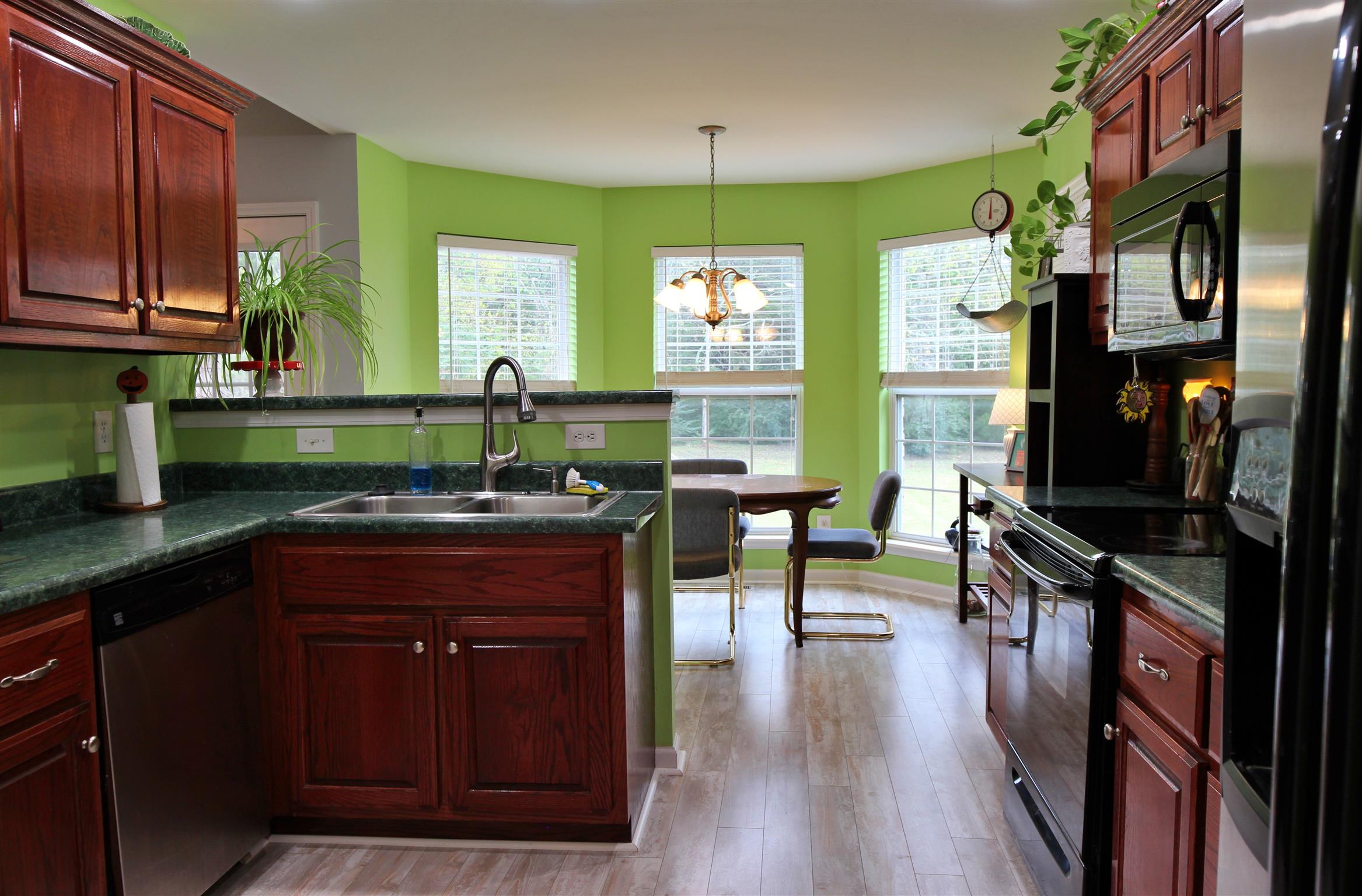 592 Windy Road Mount Juliet, TN 37122 - Photo 11 of 24 a kitchen with a table chairs stove and cabinets