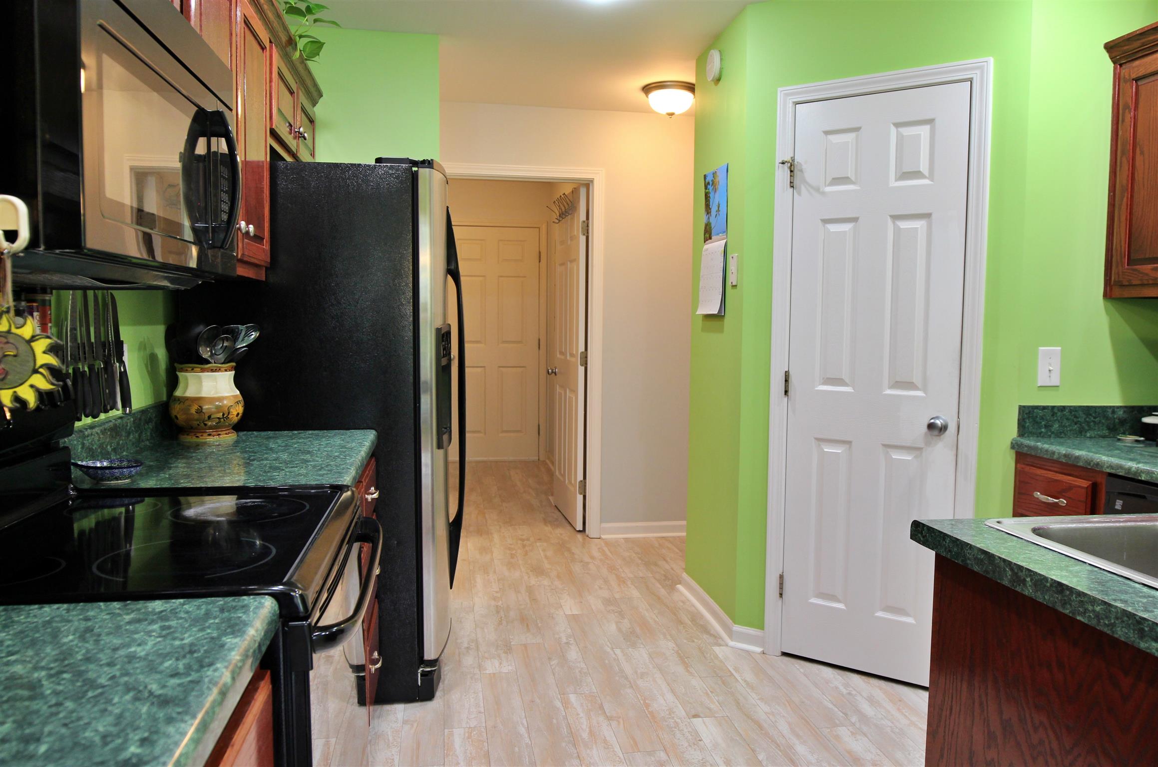 592 Windy Road Mount Juliet, TN 37122 - Photo 12 of 24 a kitchen with a refrigerator and countertop