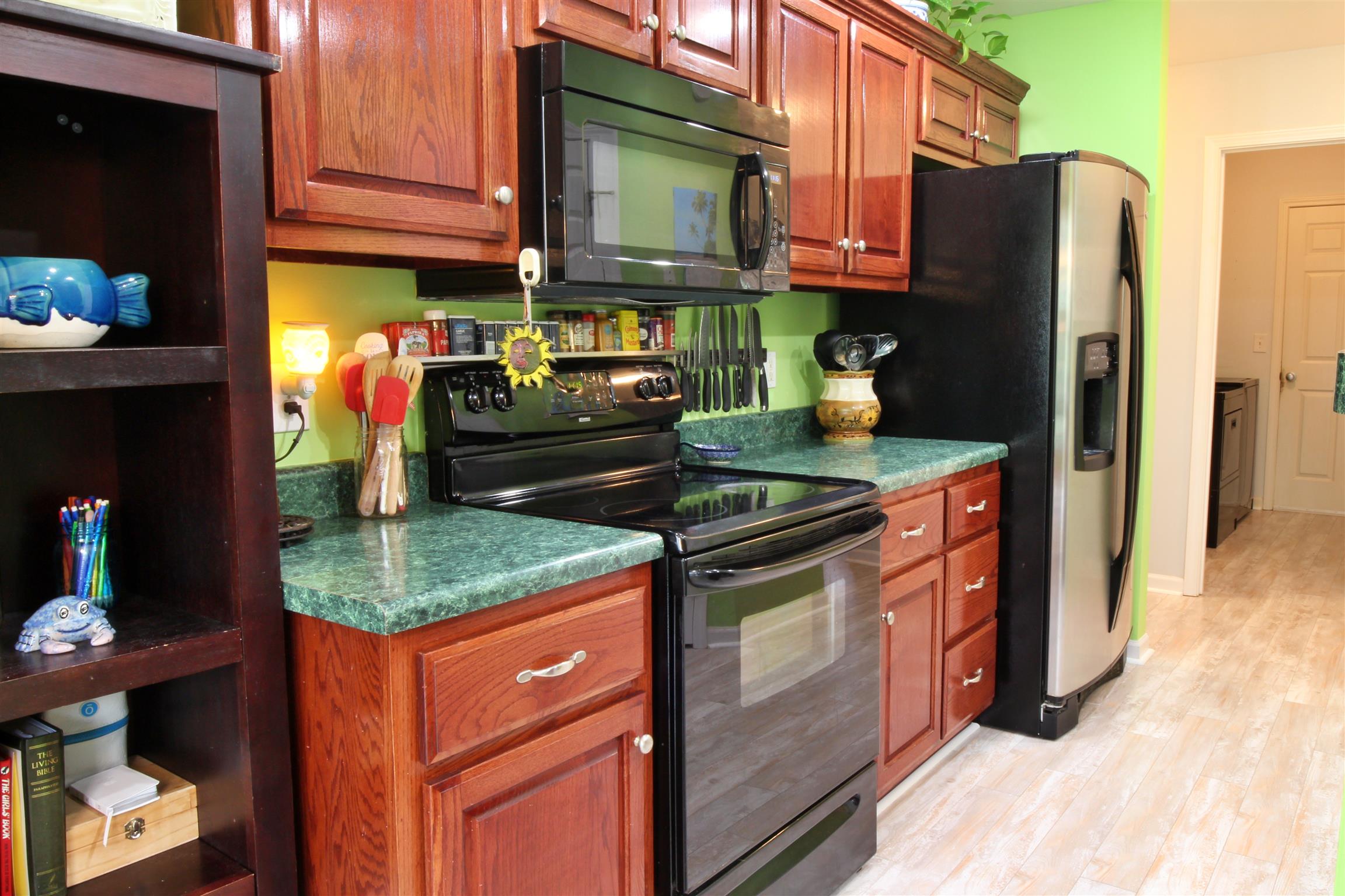 592 Windy Road Mount Juliet, TN 37122 - Photo 13 of 24 a kitchen with stainless steel appliances granite countertop a refrigerator and a stove