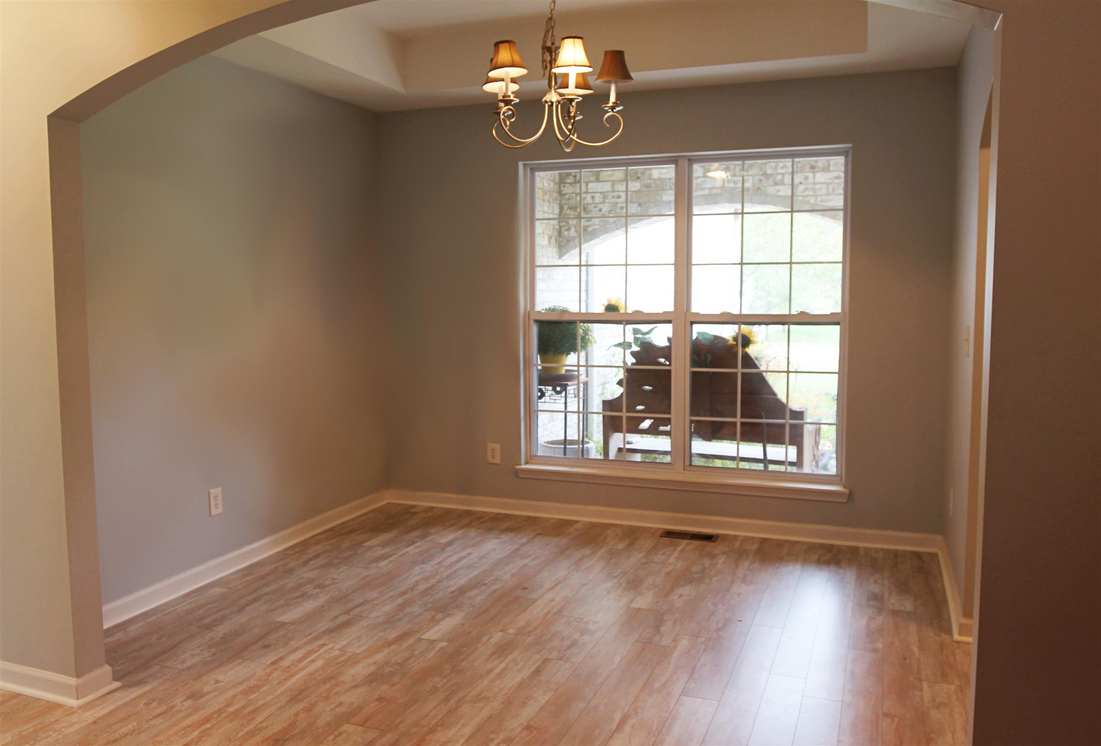 592 Windy Road Mount Juliet, TN 37122 - Photo 14 of 24 a view of an empty room with wooden floor and a window