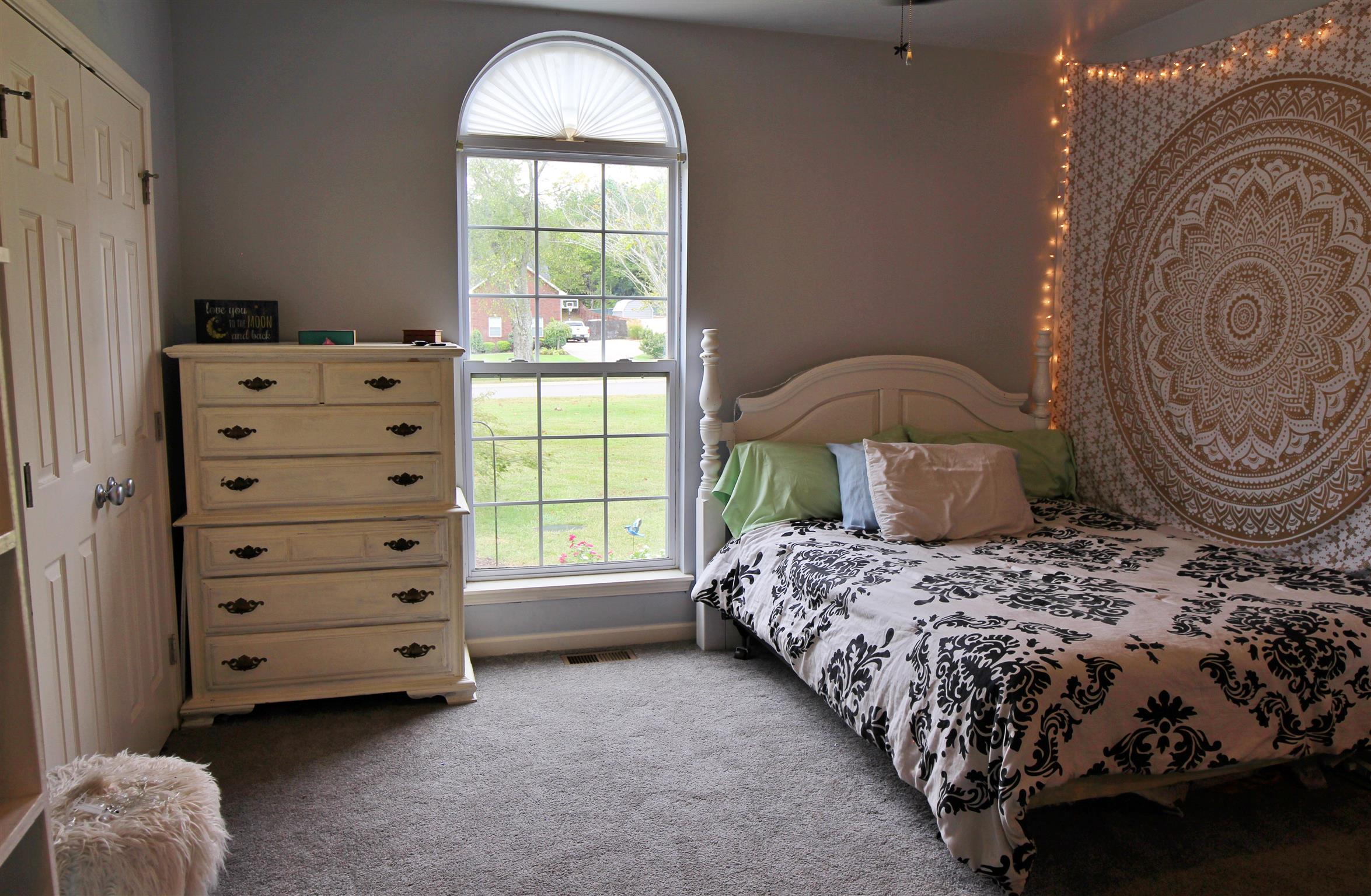 592 Windy Road Mount Juliet, TN 37122 - Photo 18 of 24 a bedroom with a bed next to a window