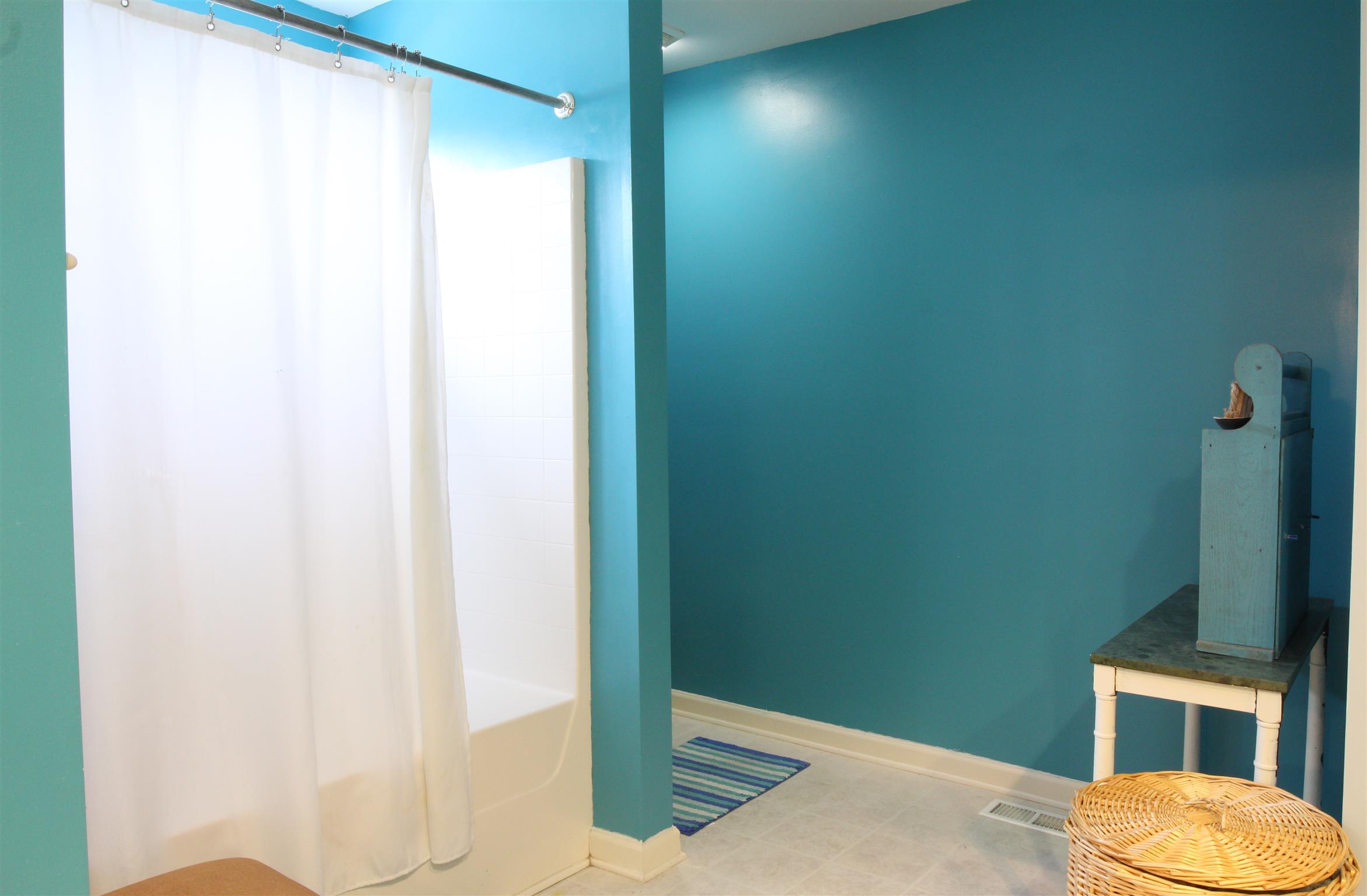 592 Windy Road Mount Juliet, TN 37122 - Photo 7 of 24 a bathroom with a toilet and a shower
