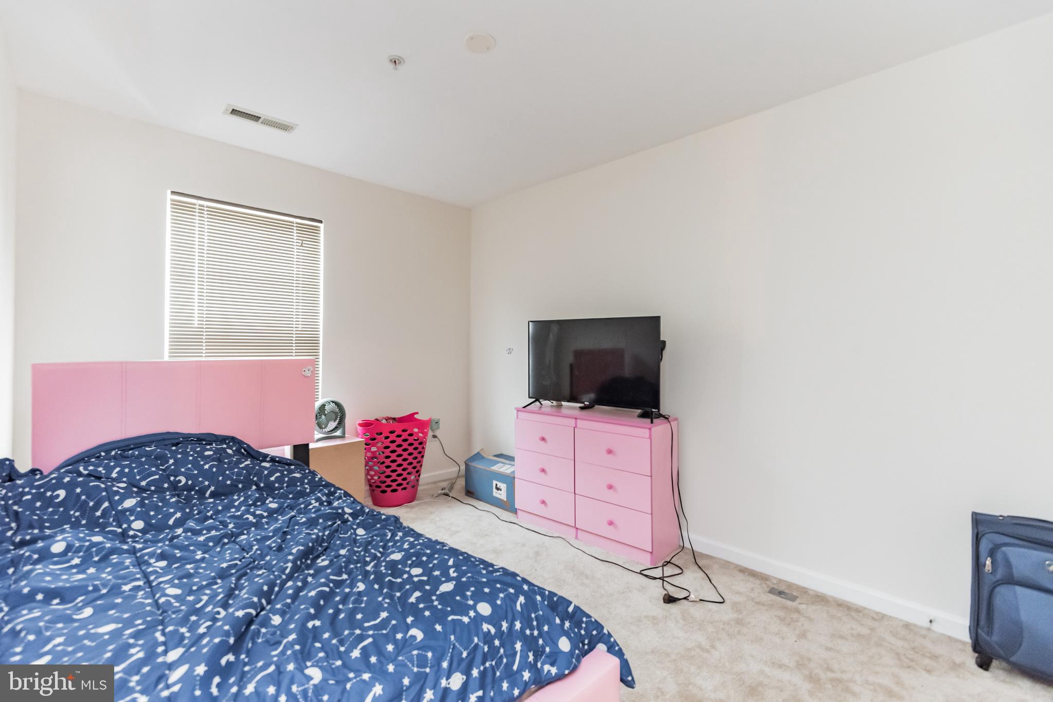 836 Lowe Road Middle River, MD 21220 - Photo 19 of 30 a bedroom with a bed and a flat screen tv