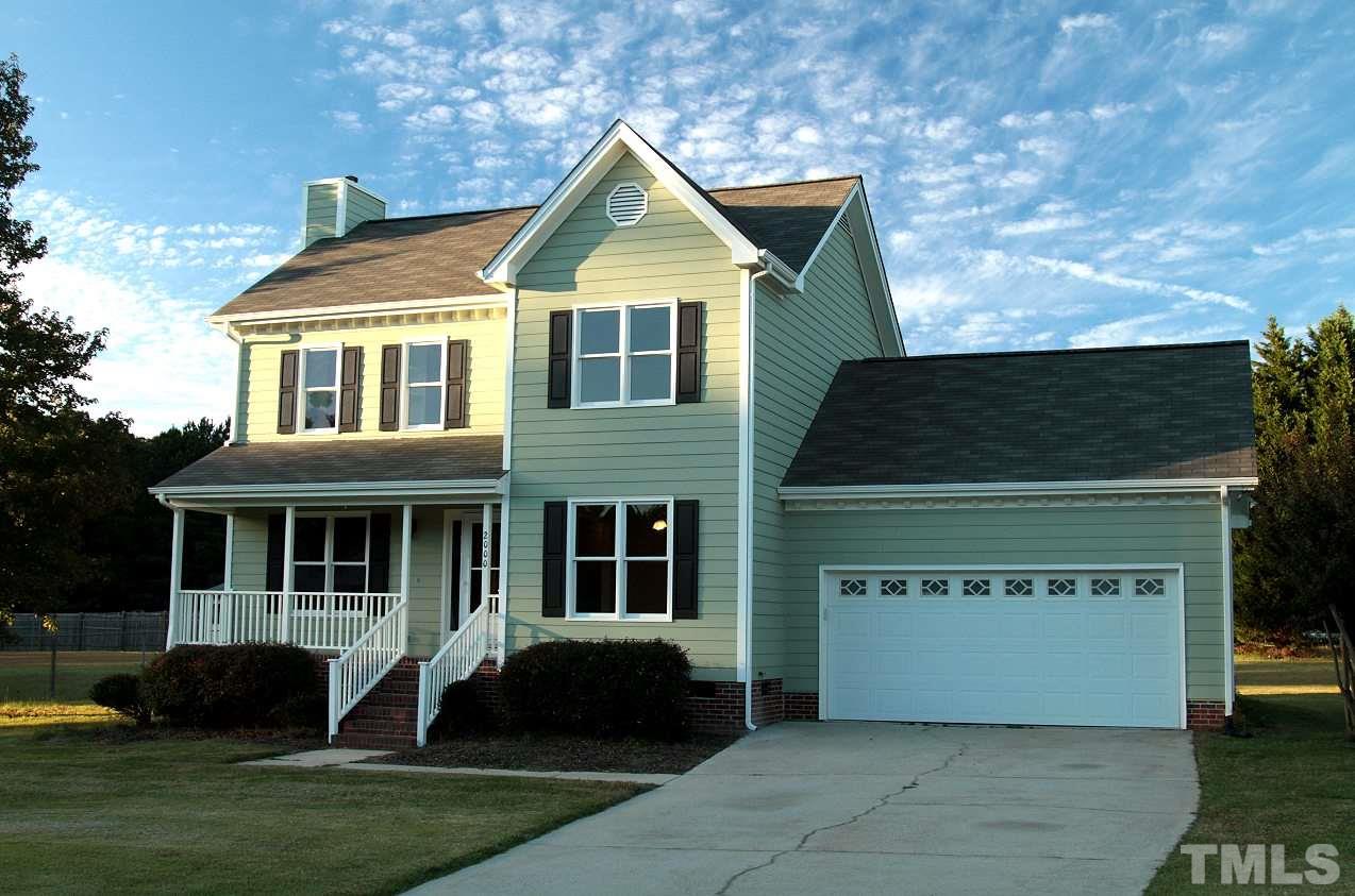 2000 Stoneglen Lane Raleigh, NC 27603 - Photo 1 of 25 a front view of a house with a yard