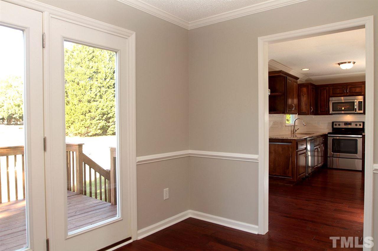 2000 Stoneglen Lane Raleigh, NC 27603 - Photo 11 of 25 a view of a hallway with wooden floor and windows