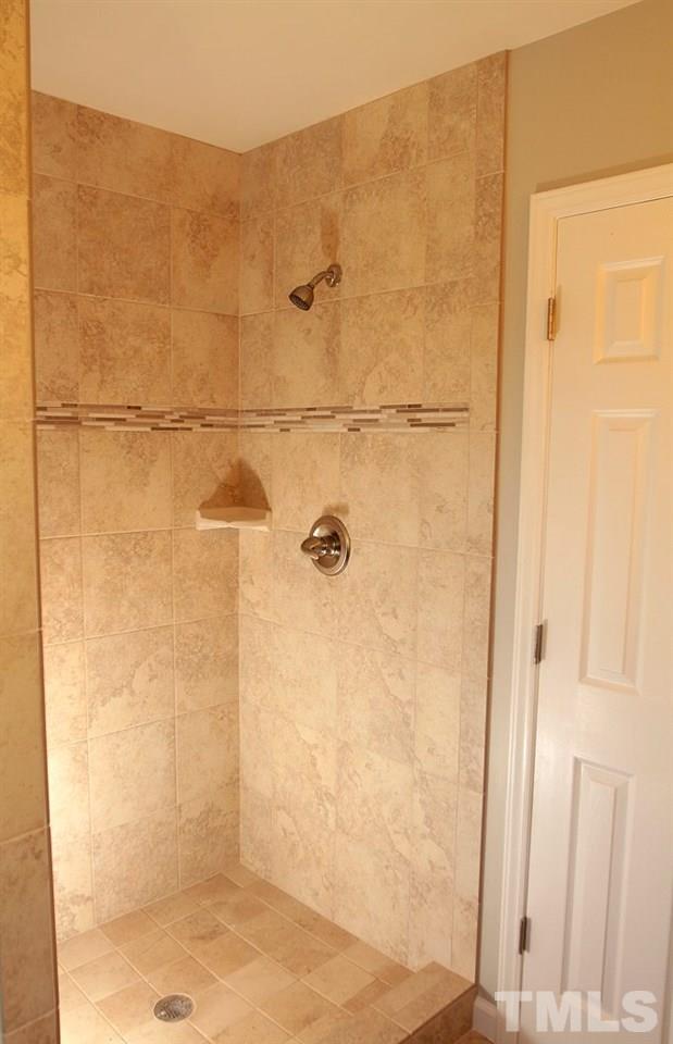 2000 Stoneglen Lane Raleigh, NC 27603 - Photo 18 of 25 a bathroom with a shower