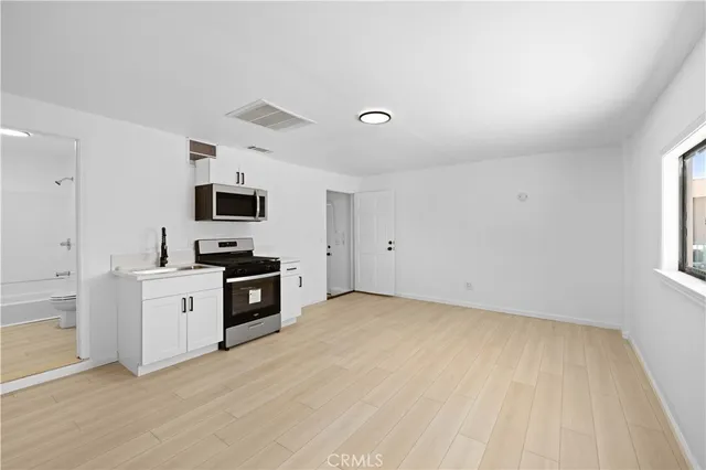 a bathroom with a sink a toilet and a bathtub