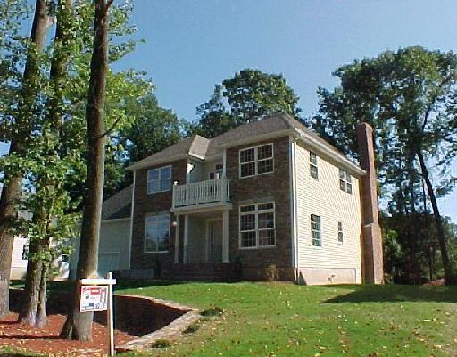 2 Ansantawae Road Milford, CT 06460 - Photo 1 of 1 a front view of a house with a yard and trees