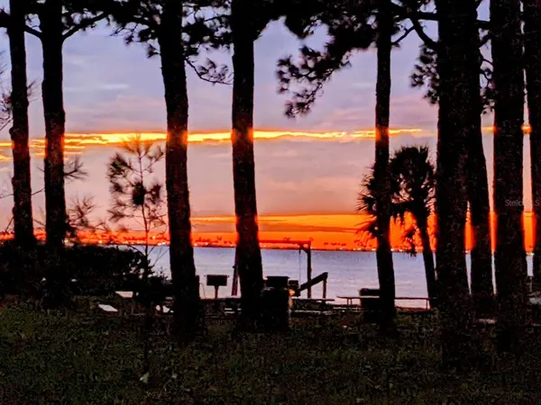 a kitchen with white cabinets sink and stainless steel appliances