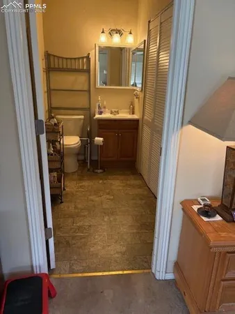 a living room with a couch and a stove next to a window