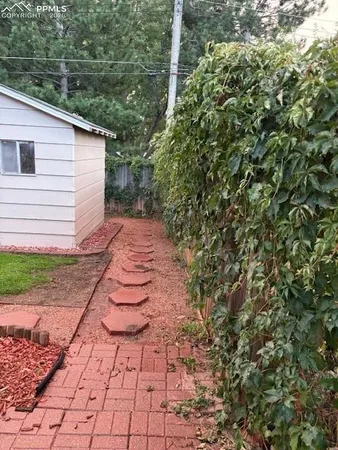 a backyard of a house with lots of green space