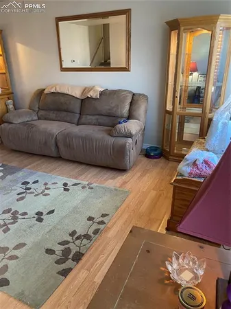 a living room with furniture window and a couch