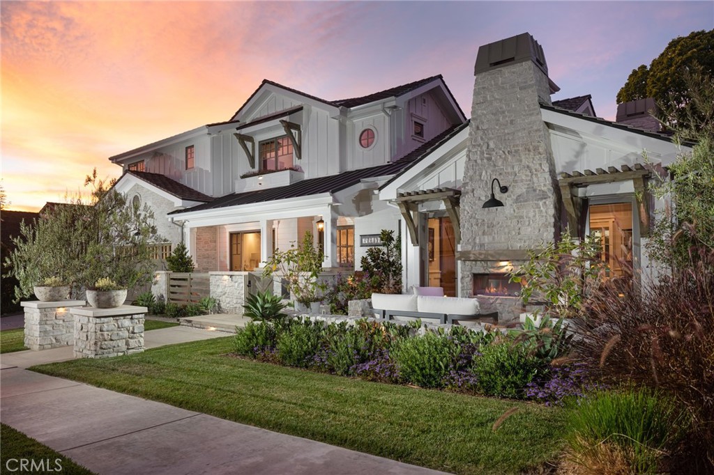 1986 Port Ramsgate Place Newport Beach, CA 92660 - Photo 1 of 1 a front view of a house with a yard