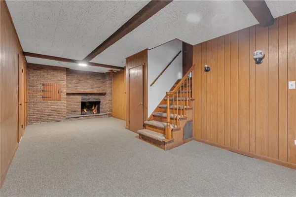 a view of empty room with fireplace