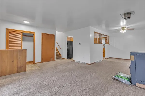 a view of an empty room with a cabinet