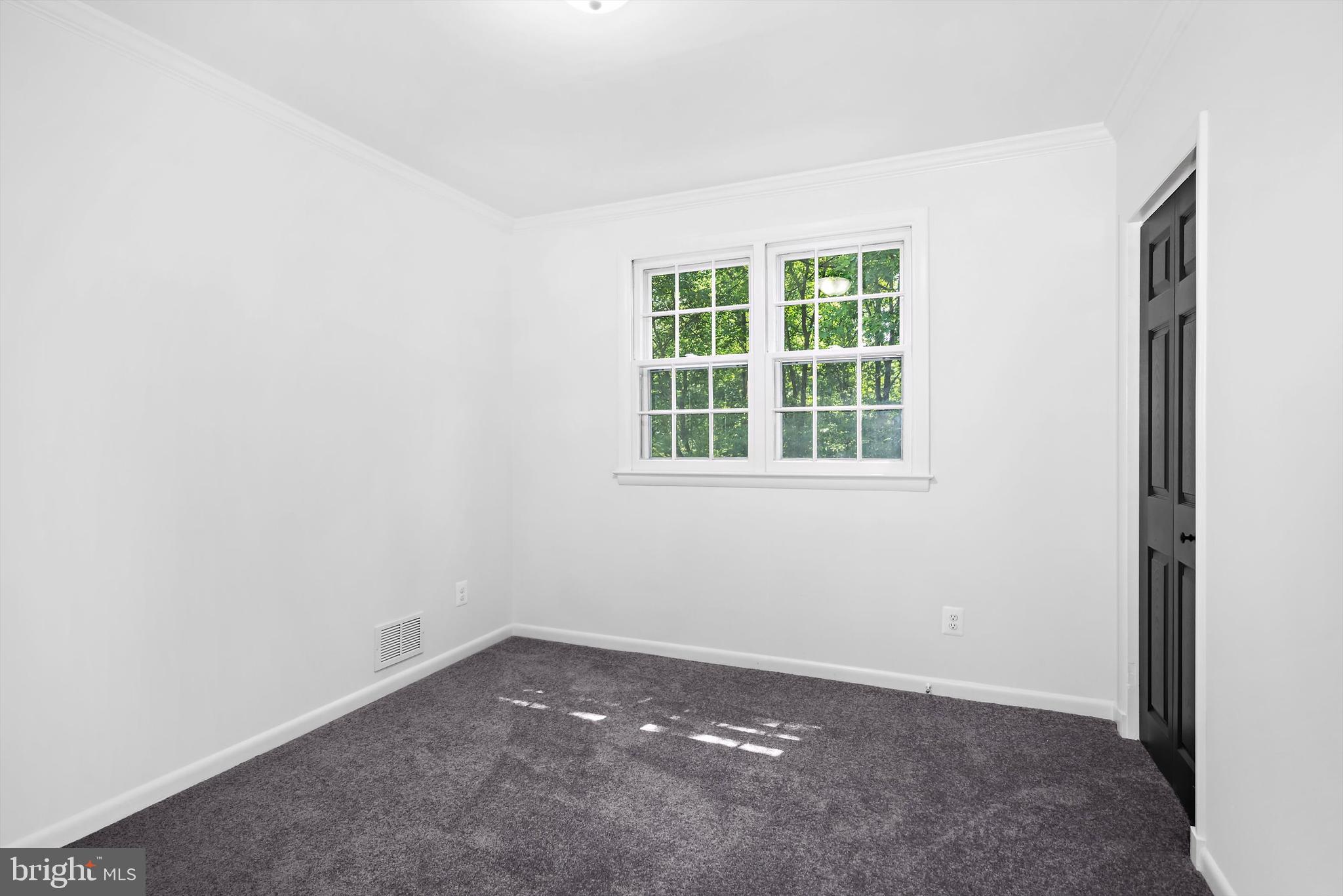 1013 Roxleigh Road Baltimore, MD 21286 - Photo 25 of 57 an empty room with a window