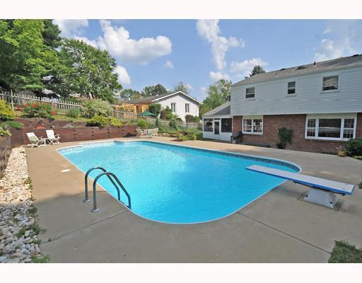 1701 Partridge Run Road Upper St. Clair, PA 15241 - Photo 2 of 18 Exterior Back. Think of the fun that your friends and family will have enjoying this in-ground pool an patio area.