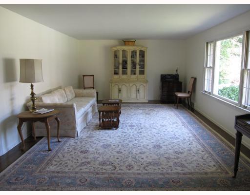 1701 Partridge Run Road Upper St. Clair, PA 15241 - Photo 8 of 18 Living Room. The huge living room has many possible uses. The large picture window looks out to the lovely pool and gardens. There are beautiful hardwood floors throughout the house.