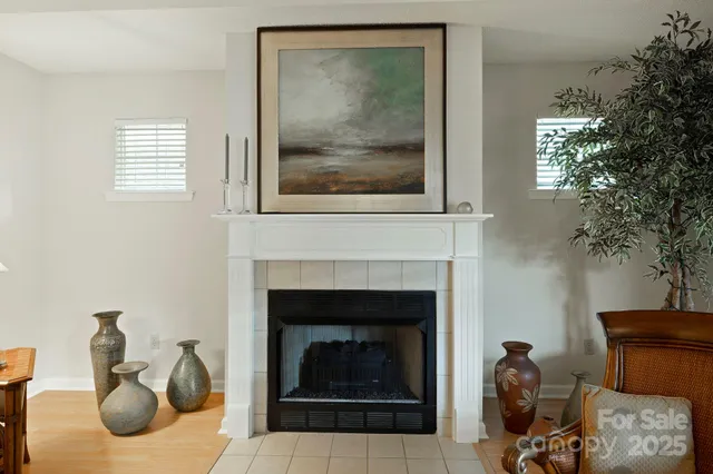 a view of a hallway to a livingroom with furniture