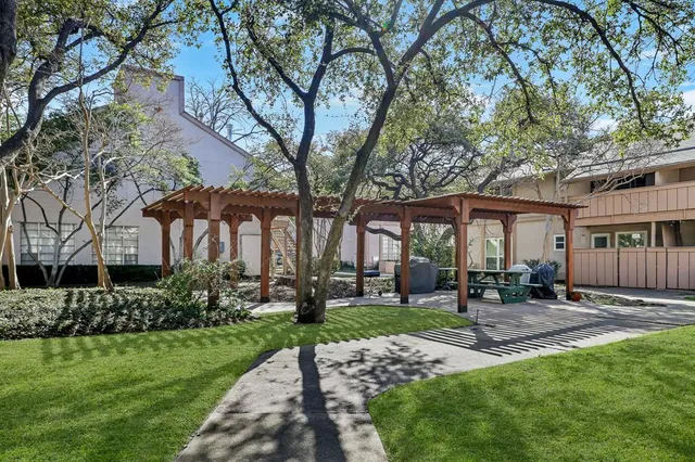 a front view of a house with a yard table and chairs