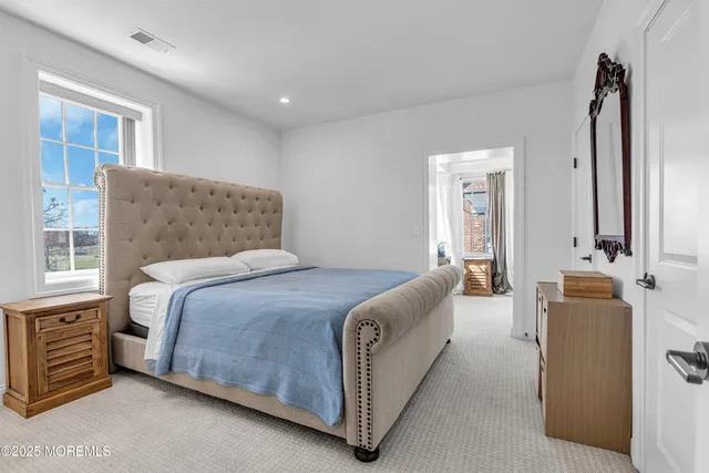 a bed room with a bed and a couch