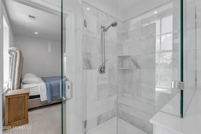 a bathroom with a bathtub and a shower