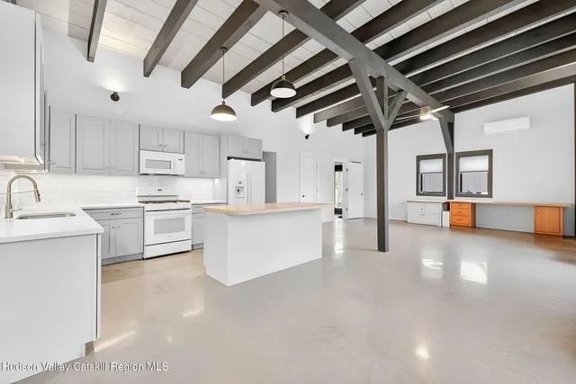 a view of kitchen with cabinets and wooden floor