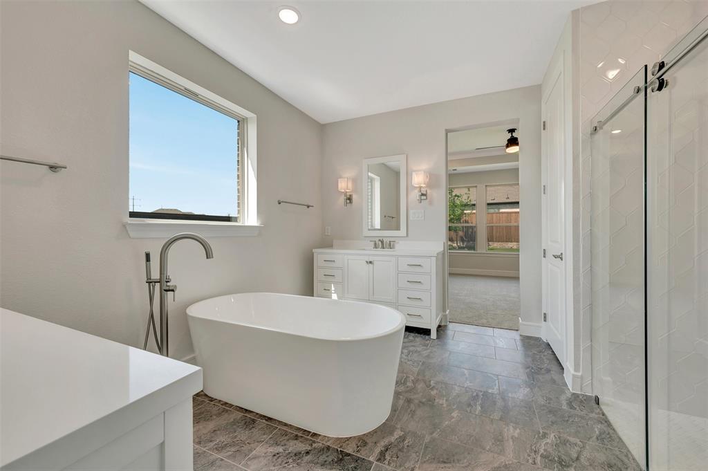 11460 Wulstone Road Fort Worth, TX 76052 - Photo 17 of 40 a large room with a sink a mirror and shower