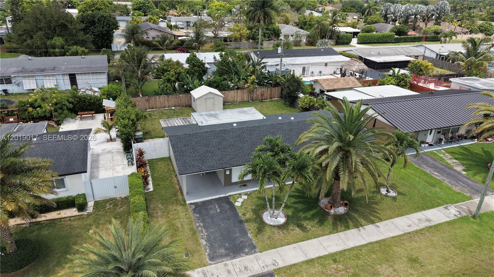 731 Northwest 17th Street Homestead, FL 33030 - Photo 22 of 29 an aerial view of a house with garden space and street view