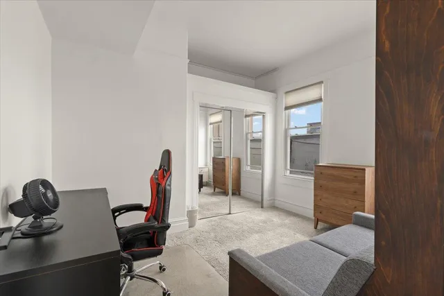 a workspace with furniture and closet