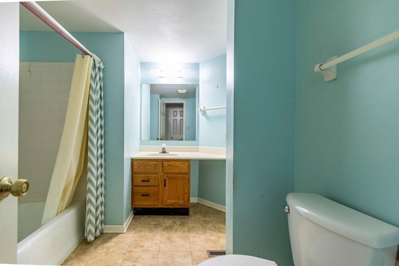 1874 Springvale Drive Crown Point, IN 46307 - Photo 14 of 26 a bathroom with a toilet a sink and shower