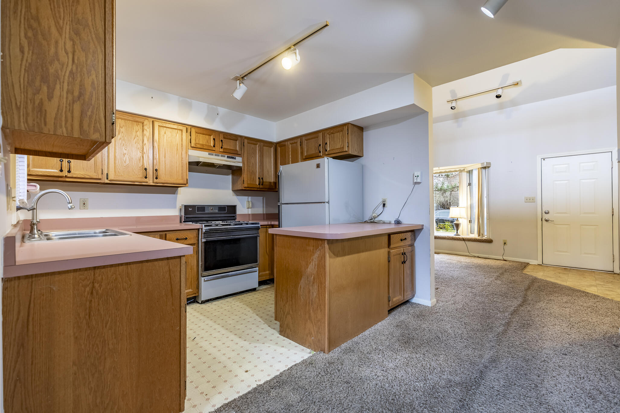 1874 Springvale Drive Crown Point, IN 46307 - Photo 9 of 26 a kitchen with stainless steel appliances granite countertop a stove a sink and a refrigerator