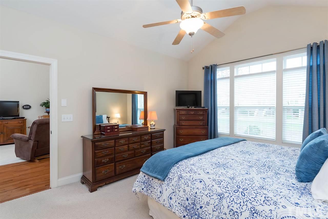 650 Democracy Street Raleigh, NC 27603 - Photo 12 of 25 a bedroom with a bed and a television
