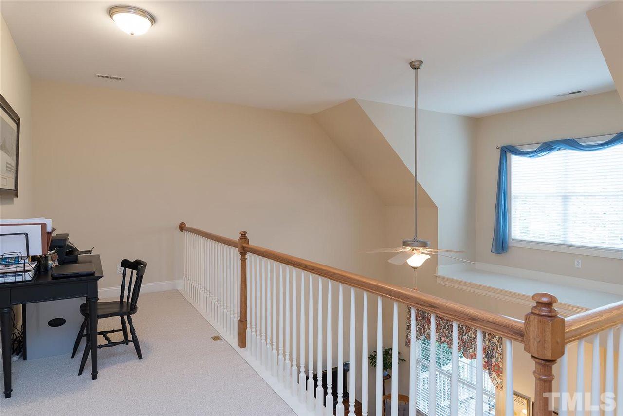 650 Democracy Street Raleigh, NC 27603 - Photo 19 of 25 a view of a hallway with workspace and a window