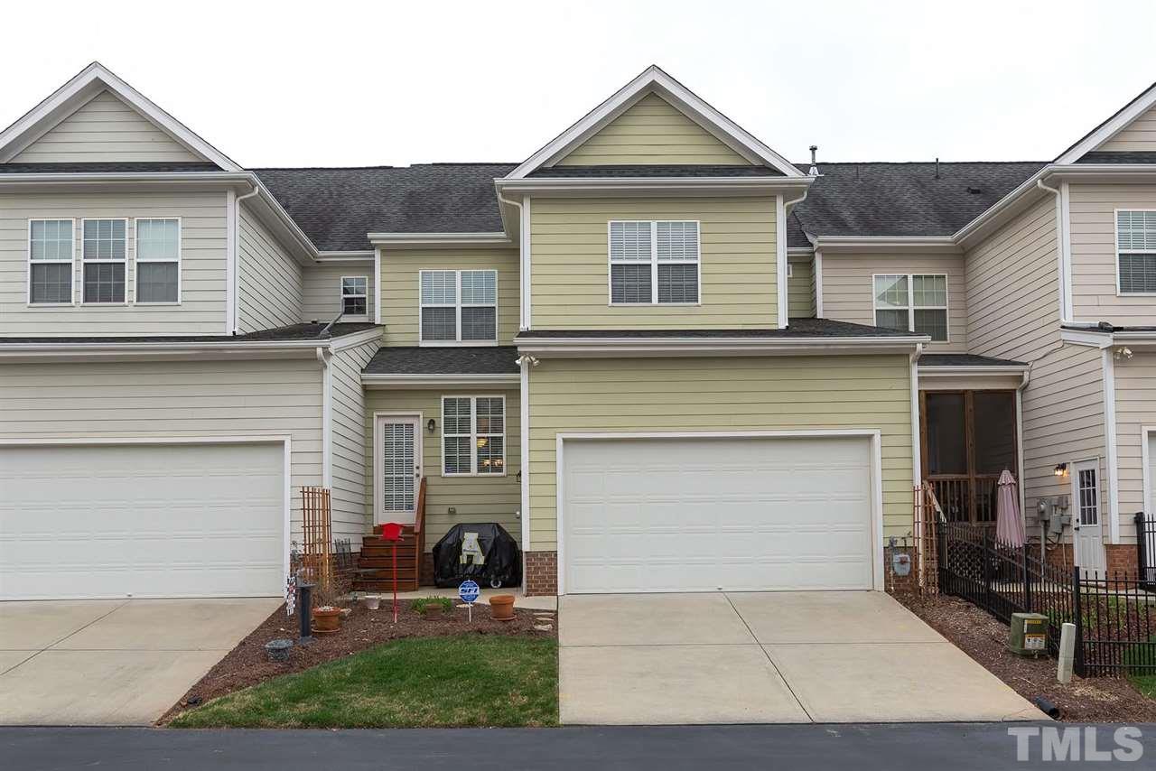 650 Democracy Street Raleigh, NC 27603 - Photo 23 of 25 a front view of a house with yard and a garage