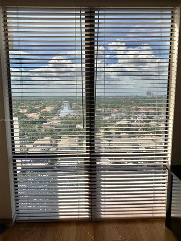 a view of a balcony next to a white wall