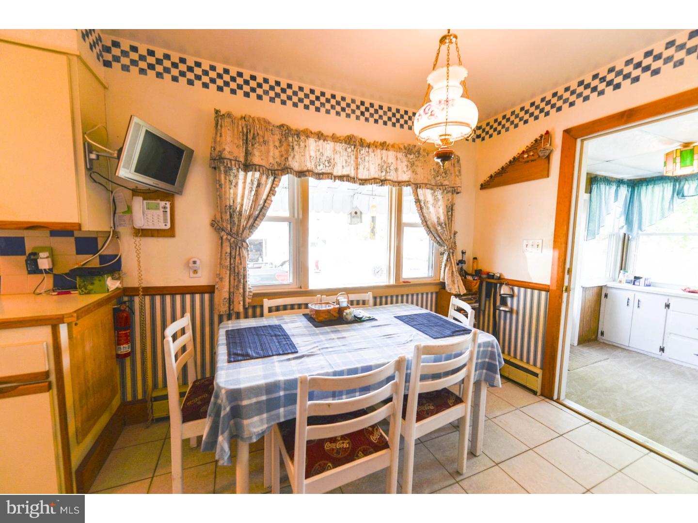 742 Salem Quinton Road Quinton, NJ 08079 - Photo 13 of 23 a dining room with furniture a chandelier and wooden floor
