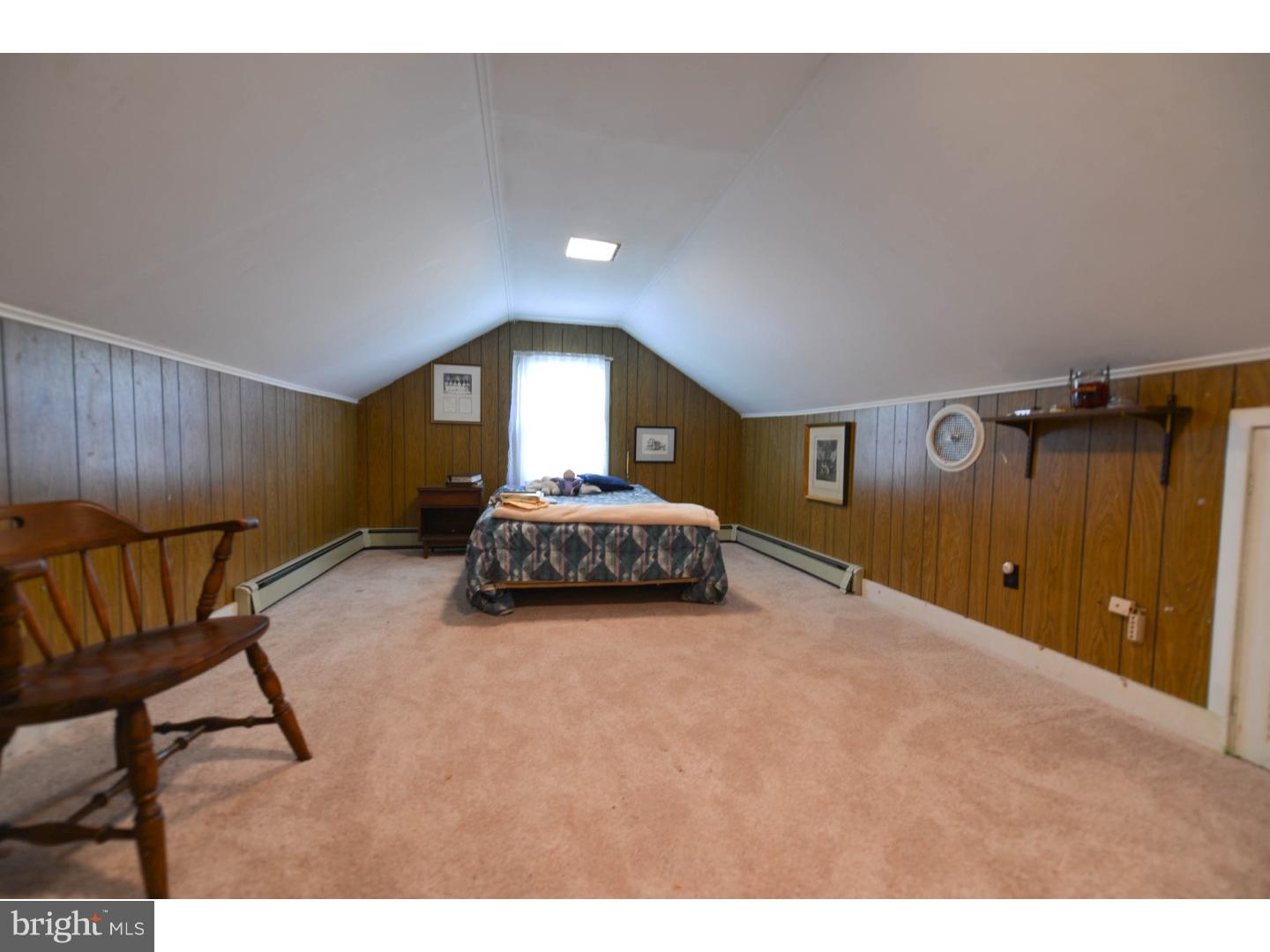 742 Salem Quinton Road Quinton, NJ 08079 - Photo 16 of 23 a spacious bedroom with a bed and a chair