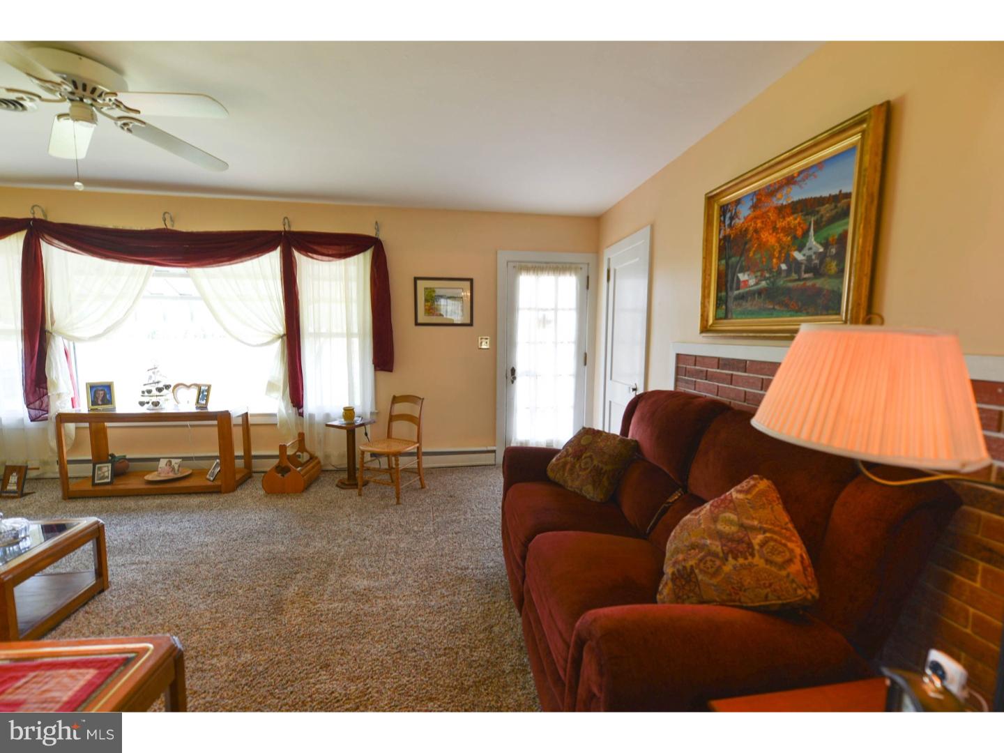742 Salem Quinton Road Quinton, NJ 08079 - Photo 5 of 23 a living room with furniture and a floor to ceiling window