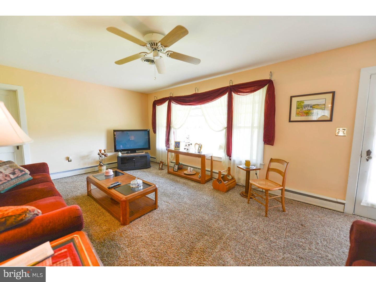 742 Salem Quinton Road Quinton, NJ 08079 - Photo 6 of 23 a living room with furniture a fireplace and a large window