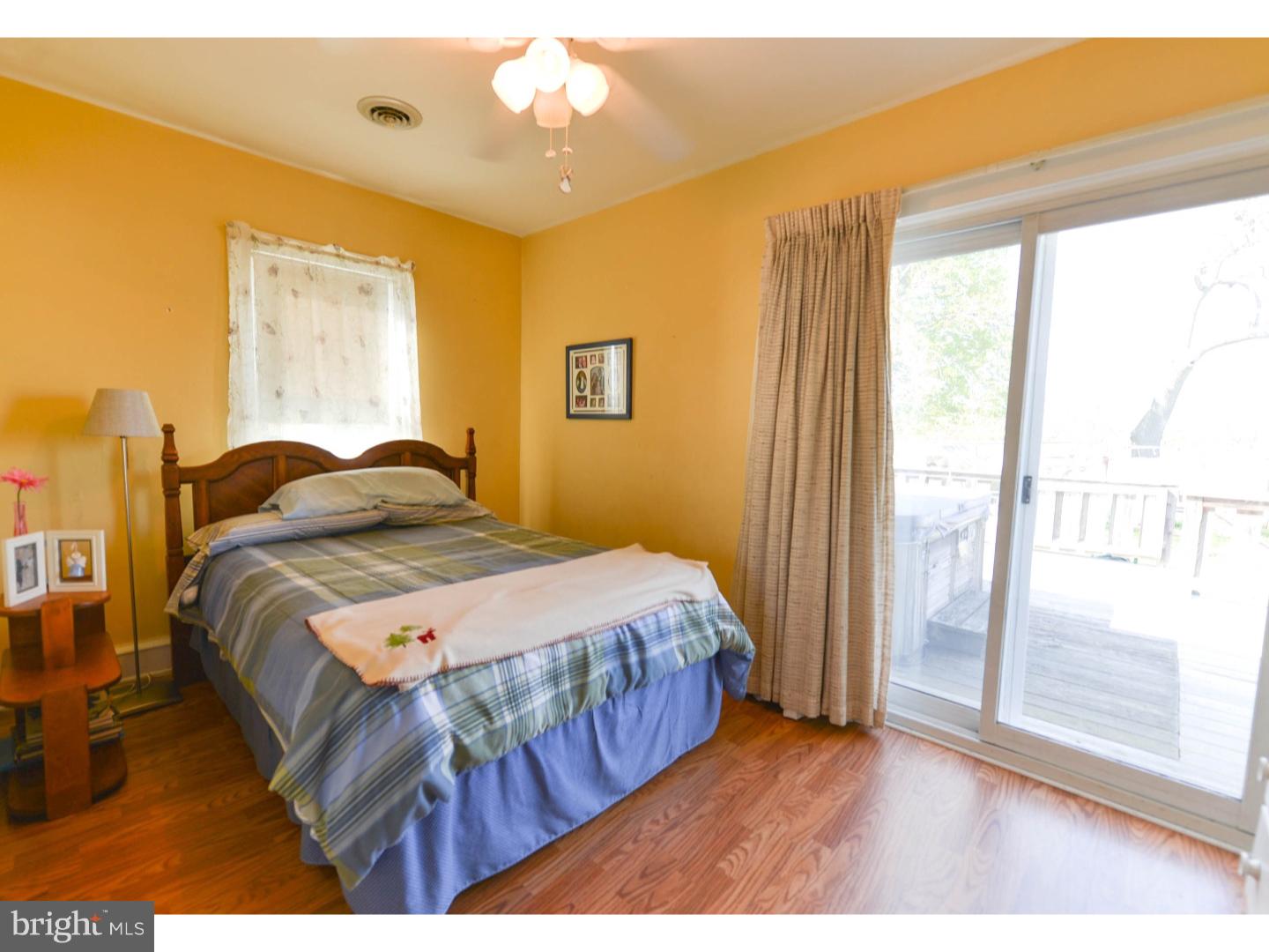 742 Salem Quinton Road Quinton, NJ 08079 - Photo 8 of 23 a bedroom with a bed and wooden floor