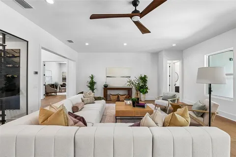 a kitchen with stainless steel appliances a sink a stove and cabinets