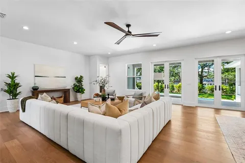 a view of room with wooden floor and fan
